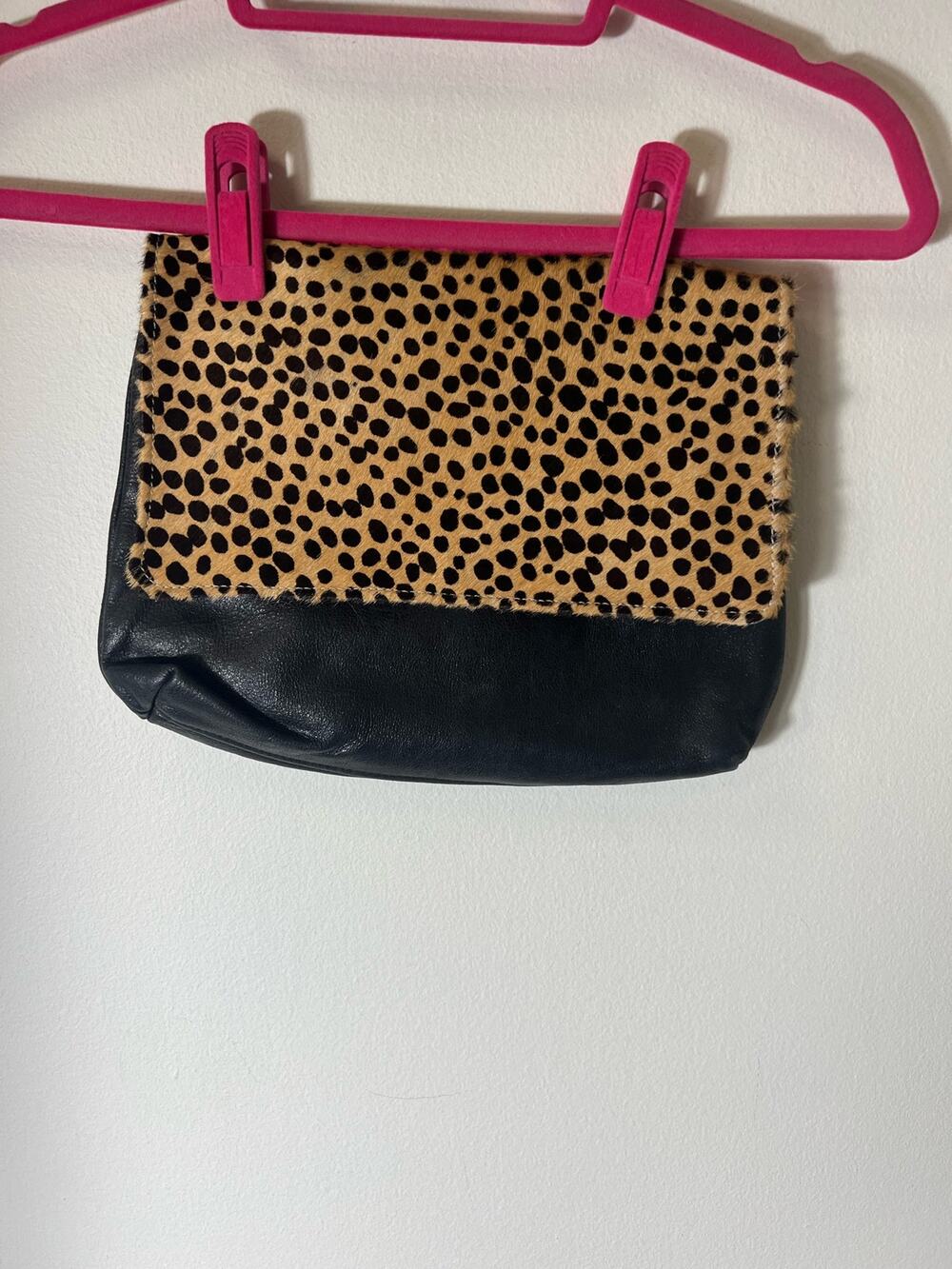 Black leather Clutch with leopard print closure and canvas lining
